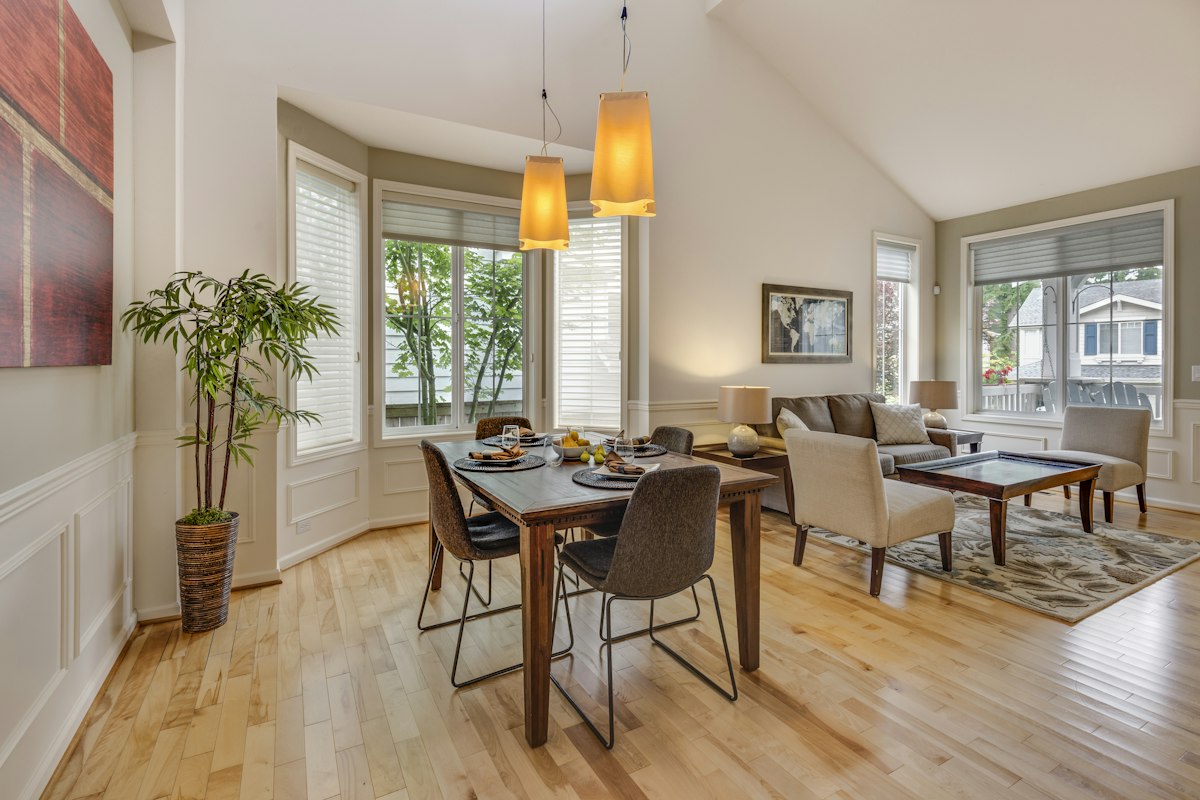 Open dining and living room with oak floors